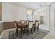 Open dining room with chandelier, decorative wall and view into home at 12523 Riverglen Dr, Riverview, FL 33569