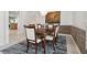 Elegant dining room with a chandelier, textured walls, and a patterned rug at 12523 Riverglen Dr, Riverview, FL 33569