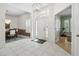 Spacious foyer with a chandelier, tiled floor, and views into the dining and exercise rooms at 12523 Riverglen Dr, Riverview, FL 33569