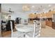 Open-concept kitchen with stainless steel appliances, a granite countertop, and a cozy breakfast nook at 12523 Riverglen Dr, Riverview, FL 33569