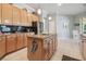 Inviting kitchen with a granite-topped island, stainless appliances, and ample cabinet space at 12523 Riverglen Dr, Riverview, FL 33569