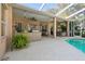 Covered lanai with bar seating, a grilling station, a hot tub and a swimming pool at 12523 Riverglen Dr, Riverview, FL 33569
