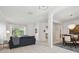 Bright and airy living room with tile flooring, white columns, and neutral decor at 12523 Riverglen Dr, Riverview, FL 33569