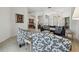 Bright living room with a comfortable sitting arrangement, dining area, and open layout at 12523 Riverglen Dr, Riverview, FL 33569