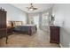 Comfortable main bedroom features carpet, ceiling fan, and sliding doors to lanai at 12523 Riverglen Dr, Riverview, FL 33569