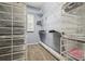 Organized walk-in closet with shelving, drawers, and carpeted floor at 12523 Riverglen Dr, Riverview, FL 33569