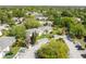 Overhead view of condos showcasing green lawns, landscaping, parking, and tree coverage at 130 Sabal Ct # C, Oldsmar, FL 34677