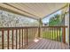 Inviting balcony featuring wood flooring and a wooden railing with scenic neighborhood views at 130 Sabal Ct # C, Oldsmar, FL 34677