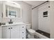 Updated bathroom showcasing subway tile shower with niche, white vanity, and stylish tile floor at 130 Sabal Ct # C, Oldsmar, FL 34677