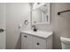 Bathroom featuring a white vanity with black hardware and matte black faucet at 130 Sabal Ct # C, Oldsmar, FL 34677