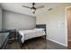 Cozy bedroom featuring a ceiling fan, dark wood floors, and a workspace with desk at 130 Sabal Ct # C, Oldsmar, FL 34677