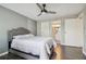 Bedroom with wood floors leading to an ensuite bathroom, offering a bright and private retreat at 130 Sabal Ct # C, Oldsmar, FL 34677