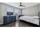 Bright bedroom with wood floors, lots of natural light, and comfortable furnishings for a relaxing retreat at 130 Sabal Ct # C, Oldsmar, FL 34677