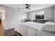 Bedroom featuring a large flat-screen television, desk, and dark wood floors at 130 Sabal Ct # C, Oldsmar, FL 34677