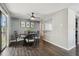 Charming dining area with wood floors, a modern ceiling fan, and decoratively framed artwork at 130 Sabal Ct # C, Oldsmar, FL 34677