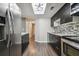 Spacious kitchen with stainless steel appliances, dark wood cabinets, and open layout, blending style and functionality at 130 Sabal Ct # C, Oldsmar, FL 34677