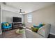 Cozy living room boasts ample natural light, stylish furniture, and a modern aesthetic creating an inviting space at 130 Sabal Ct # C, Oldsmar, FL 34677