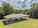 Up close aerial view of community pavilion with picnic tables, offering a great spot for outdoor gatherings at 130 Sabal Ct # C, Oldsmar, FL 34677