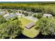 Scenic aerial view of the community lakeside pavilion area with nearby residences and roads at 130 Sabal Ct # C, Oldsmar, FL 34677