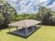 Close aerial shot showcasing an open-air pavilion with seating area, perfect for social gatherings in community at 130 Sabal Ct # C, Oldsmar, FL 34677