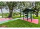 Outdoor picnic area with BBQ grills and picnic tables by the lake, ideal for community gatherings at 130 Sabal Ct # C, Oldsmar, FL 34677