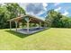 Community picnic pavilion with tables and benches, situated in a green area with a water fountain at 130 Sabal Ct # C, Oldsmar, FL 34677