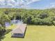 Aerial view of the community picnic pavilion overlooking a beautiful lake with fountain views at 130 Sabal Ct # C, Oldsmar, FL 34677