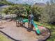 Community playground with slides, climbing features, and swings for the Gathering at 130 Sabal Ct # C, Oldsmar, FL 34677