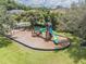 Community playground with slides, climbing features, and swings for the Gathering at 130 Sabal Ct # C, Oldsmar, FL 34677
