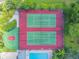 Aerial view featuring community tennis and basketball courts adjacent to the swimming pool at 130 Sabal Ct # C, Oldsmar, FL 34677