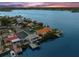 Breathtaking aerial view of a waterfront home with private boat dock and sparkling water views at 139 Wall St, Redington Shores, FL 33708