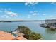 Aerial view of waterfront property with pool and boat dock with bay views at 139 Wall St, Redington Shores, FL 33708
