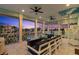 Enjoy gorgeous sunsets from the balcony with fire pit, seating, and water views at 139 Wall St, Redington Shores, FL 33708