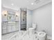 Neutral bathroom featuring marble floors, sleek vanity, modern fixtures, and glass-enclosed shower at 139 Wall St, Redington Shores, FL 33708