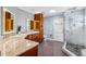 Elegant bathroom with double sinks, granite countertops, a spacious shower and luxury finishes at 139 Wall St, Redington Shores, FL 33708