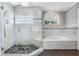 This bathroom has a large glass shower and tub at 139 Wall St, Redington Shores, FL 33708