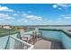 Outdoor deck with views of the water at 139 Wall St, Redington Shores, FL 33708
