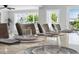 Dining room with elegant table setting, large windows, and serene outdoor views at 139 Wall St, Redington Shores, FL 33708