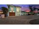 Beautiful waterfront home with large windows, a well-maintained lawn, and brick-paved driveway at 139 Wall St, Redington Shores, FL 33708