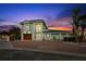 Stunning two-story home with a vibrant exterior paint, lush landscaping, and a spacious driveway at 139 Wall St, Redington Shores, FL 33708