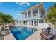 Stunning two-story home with an inviting backyard oasis and a refreshing pool at 139 Wall St, Redington Shores, FL 33708