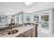 Kitchen features a large sink, granite countertops, and an outdoor water view at 139 Wall St, Redington Shores, FL 33708