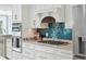 Gourmet kitchen with granite countertops, stainless steel appliances, and stylish backsplash at 139 Wall St, Redington Shores, FL 33708