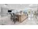 Spacious open kitchen features an island with seating, marble floors, and stainless steel appliances at 139 Wall St, Redington Shores, FL 33708