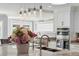 The kitchen features a large island with pendant lighting, granite countertops, stainless appliances, and ample space at 139 Wall St, Redington Shores, FL 33708