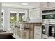 Kitchen bar with seating that looks out onto a scenic view of the waterway at 139 Wall St, Redington Shores, FL 33708