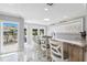 Bright kitchen bar has a waterfront view, marble floors and skylight at 139 Wall St, Redington Shores, FL 33708