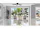 Bright sitting room area with marble floors, stylish chairs, and a water view at 139 Wall St, Redington Shores, FL 33708