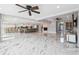 Expansive living room featuring marble floors, a fireplace, and an open layout at 139 Wall St, Redington Shores, FL 33708