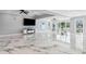 Stylish living room with marble floors, modern decor, and waterfront views at 139 Wall St, Redington Shores, FL 33708